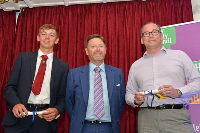 Mick Spittle, from Qube Modular Buildings with Sporting Achievement Award Finalists Joseph Stockdale at Wellingborough School and a representative of James Annable from Redwell Primary School.