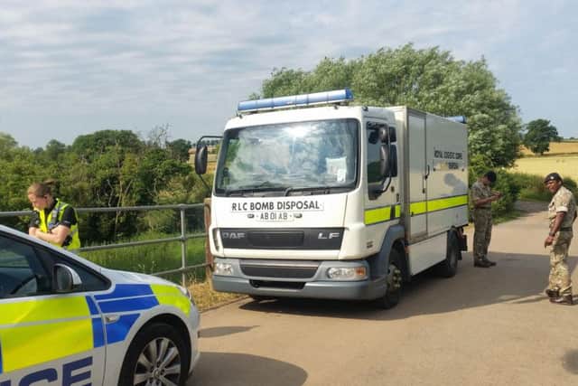 The bomb disposal team arriving at the scene this morning.
