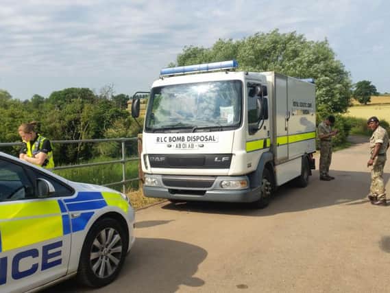 The bomb disposal team arriving at the scene this morning.