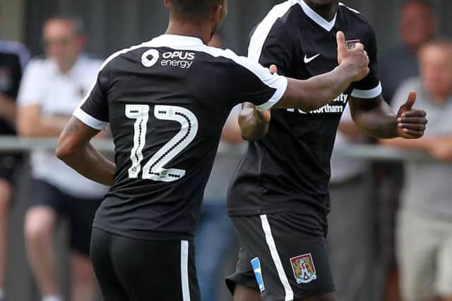 Leon Barnett celebrates the opener