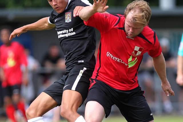 Shaun McWilliams in a midfield tussle