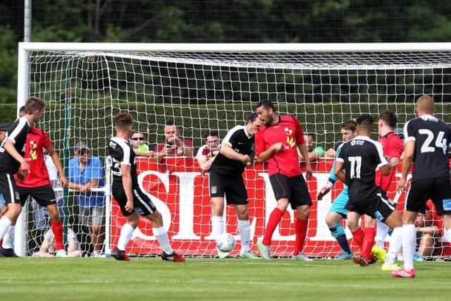 Joe Iaciofano scores the first of his three goals in Saturday's friendly win. Picture by Sharon Lucey