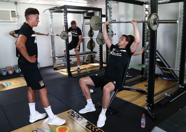 NEW BOYS TOGETHER - Regan Poole (left) and watches on as Ashton Taylor does some weights work in the Oliva Nova gym (Picture: Pete Norton)