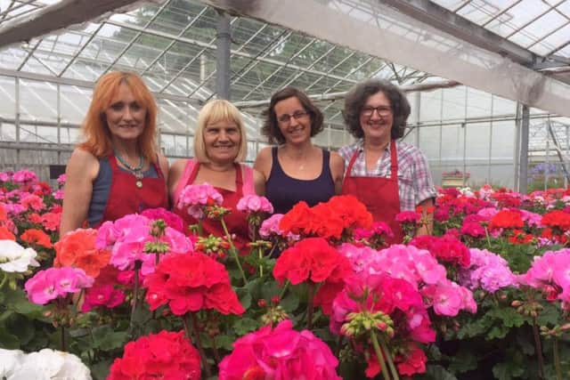 The girls at the Cramden Nursery with their award-winning flowers.