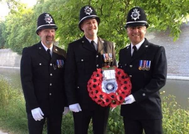 PCs Bathe, Meadwell and Cox with the Northamptonshire wreath they laid at the Menin Gate memorial