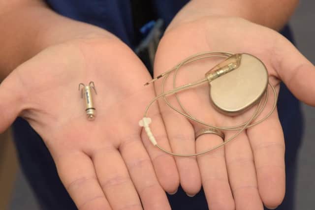 The new leadless pacemaker, left, next to a conventional device. It is small enough to be implanted directly into the heart.