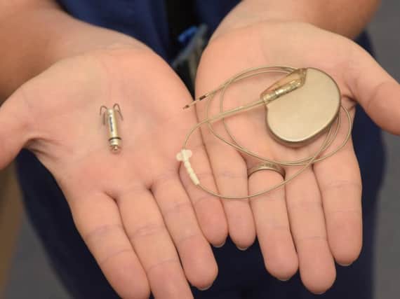 The new leadless pacemaker, left, next to a conventional device. It is small enough to be implanted directly into the heart.