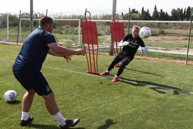 Goalkepper David Cornell is put through his paces by goalkeeper coach Jim Hollman in Spain (Picture: Pete Norton)