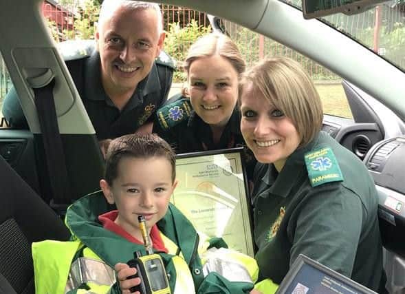 Kyran being presented with his award
