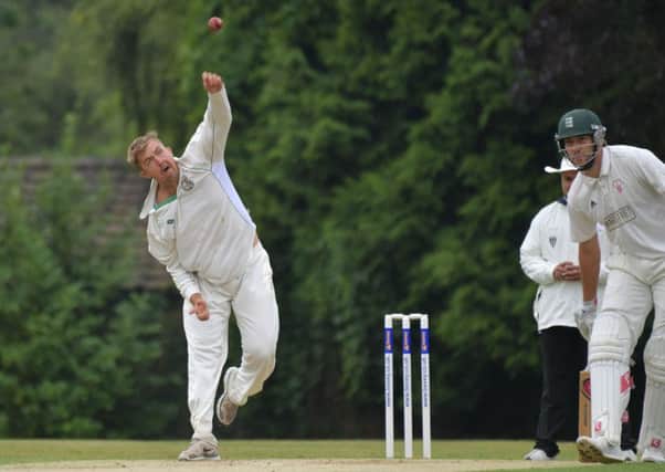 Andrew Reynoldson in bowling action for Rushton during their win at Horton House (Pictures: Dave Ikin)