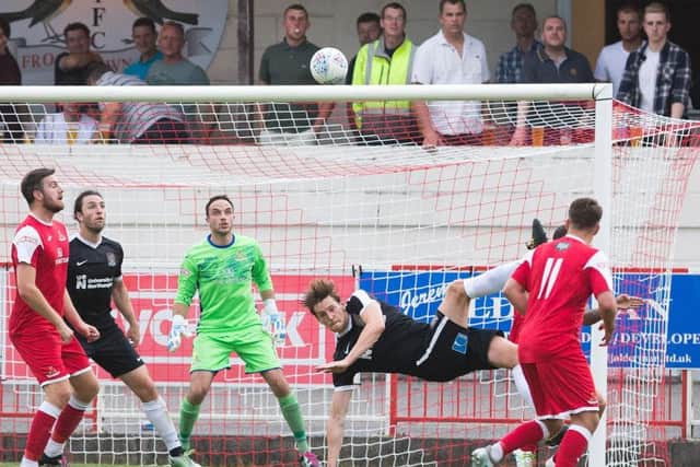 TAKE OFF: Ash Taylor's spectacular overhead kick landed on the roof of the net. Pictures: Kirsty Edmonds