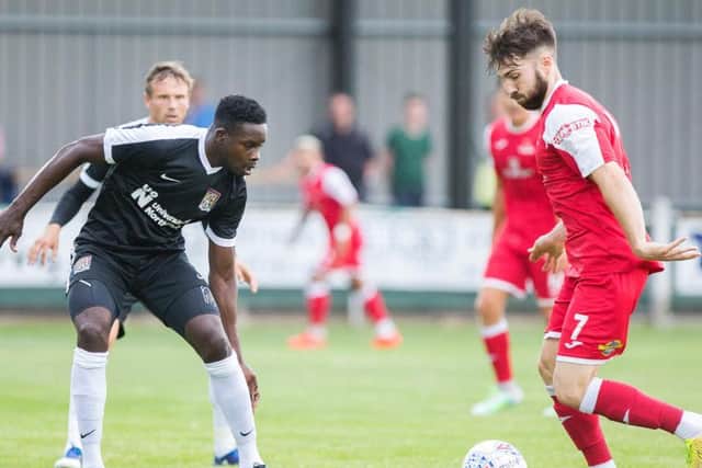 Leon Barnett keeps his eye on the ball