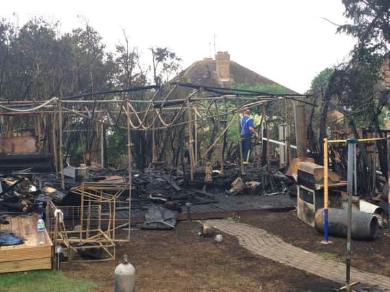 A private backyard pub with a jacuzzi and bar was destroyed in the blaze.