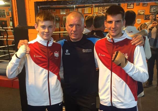 Eithan James (left) and Ben Vaughan (right) with Kings Heath ABC head coach Arthur Daly