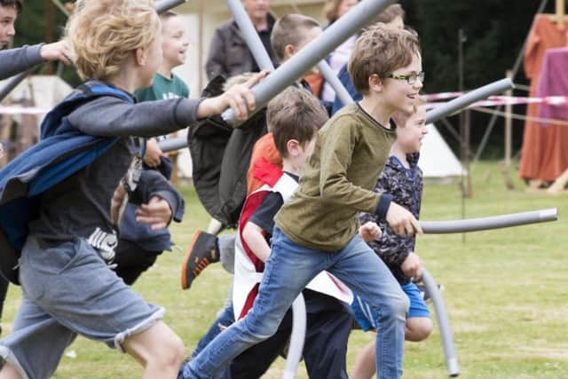 Children were invited to do battle with the re-enacters with foam swords.