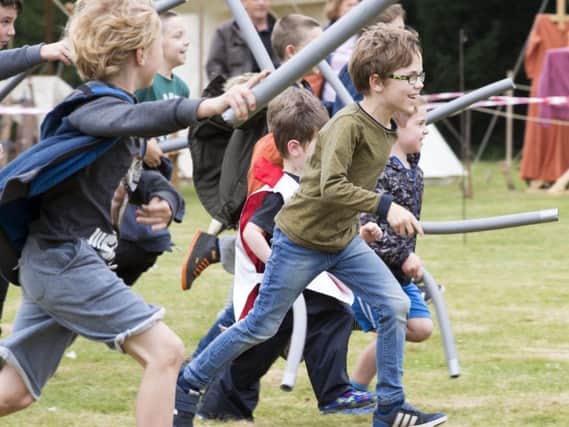 Children were invited to do battle with the re-enacters with foam swords.