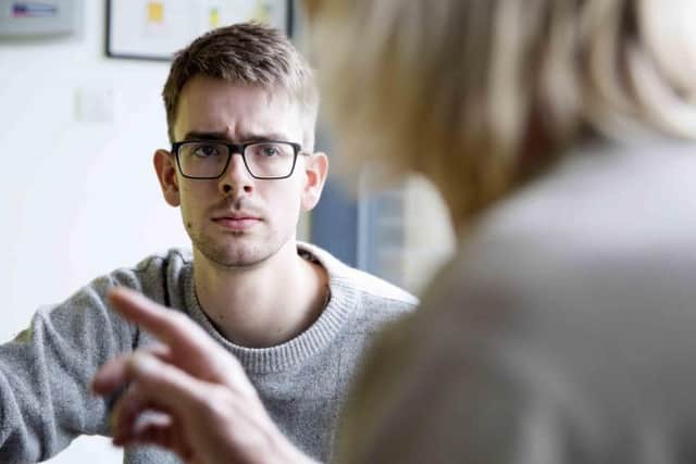 Reporter Alastair Ulke interviews clients at the Hope Centre.