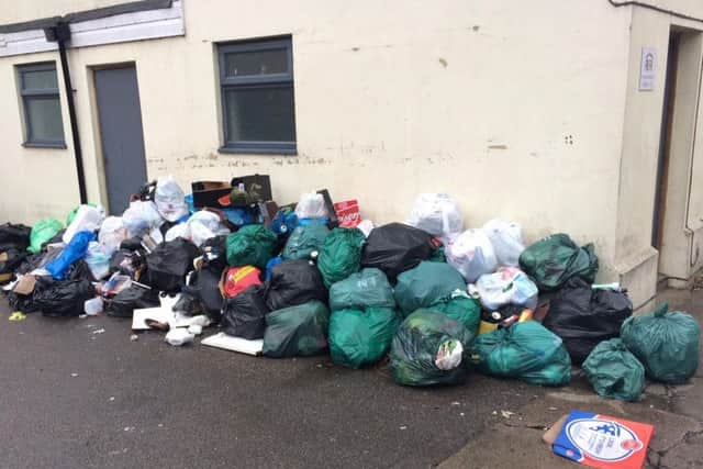 The rubbish pile in Cowper Street, off Kettering Road, has been labelled a disgrace by residents.