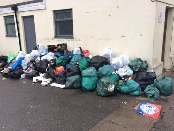 The rubbish pile in Cowper Street, off Kettering Road, has been labelled a disgrace by residents.