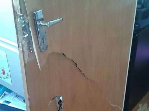 The raiders broke open a door to get into the premises.