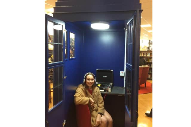 A shopper tries out the new turntable Tardis for sampling second-hand records.
