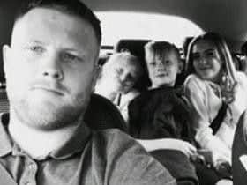 Daniel Butcher with his three children.