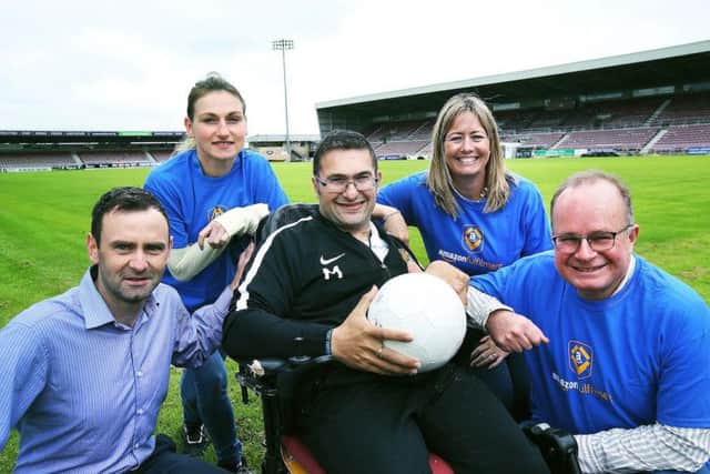 James Whiting (chief exec, Northampton Town FC), Kinga Jastrzebska (Amazon Daventry), Cobblers fan Mustafa El-Bayati, Rachel Kelly (Amazon Daventry), and David Tindal (Amazon Daventry Fulfilment Centre manager)