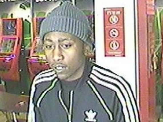Police would like to speak to the man pictured in connection with an assault at a Northampton bookmakers.