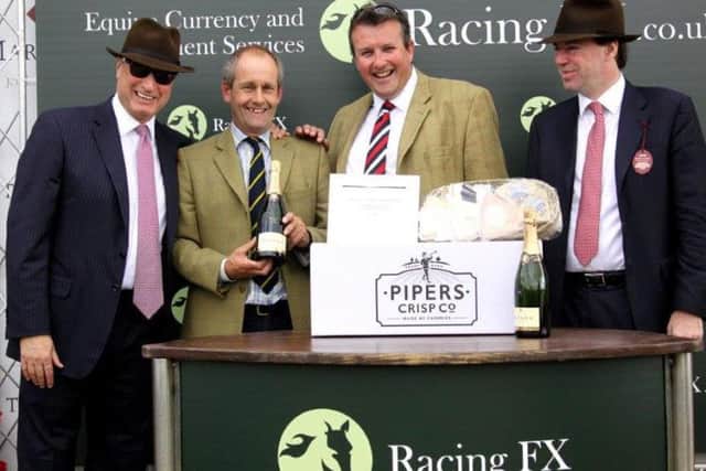 Tyringham trainer Stuart Edmunds (second left) is increasing numbers in preparation for the serious National Hunt season