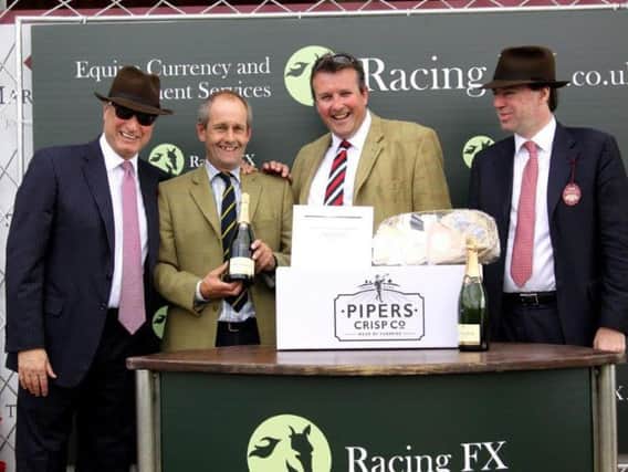 Tyringham trainer Stuart Edmunds (second left) is increasing numbers in preparation for the serious National Hunt season