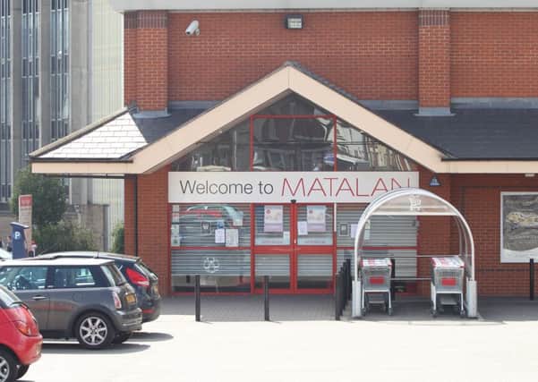 A woman was threatened at knifepoint outside Matalan in Wellingborough