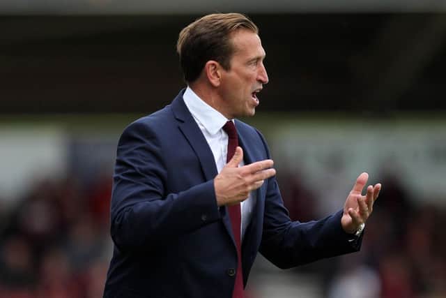 Town boss Justin Edinburgh urges his side on from the touchline. Pictures: Sharon Lucey