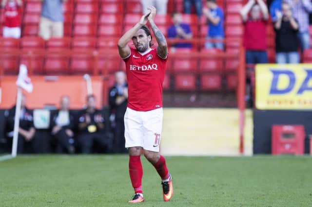 Familiar face: Ricky Holmes applauds the Cobblers fans during last year's fixture at The Valley