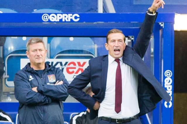 Justin Edinburgh (right) insists Cobblers will bring in a new goalkeeper before the transfer window closes (picture: Kirsty Edmonds)