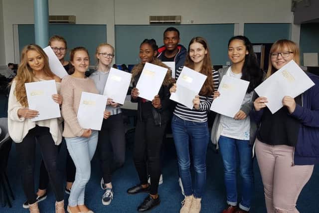 Star pupils at the Duston School with their results.