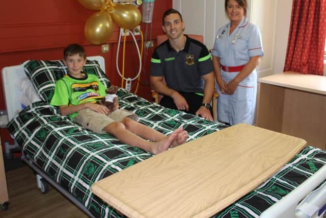 Young patients can have their room furnished with personalised bedsheets, like this boy's Saints colours.