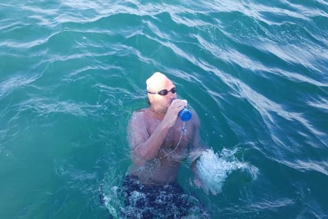 Jean-Michel briefly takes a sip of water before setting off again to complete his crossing.