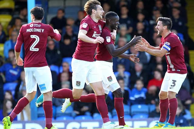 Leon Barnett celebrates opening the scoring for the Cobblers at Southend