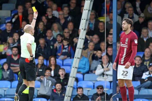 Matt Crooks is shown his second yellow card at Roots Hall