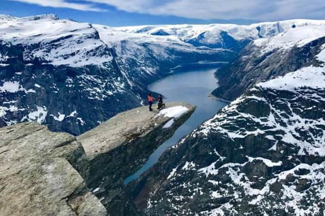 The winning photo, taken by the couple's guide, sees Ross propose on a cliff-edge in Norway.