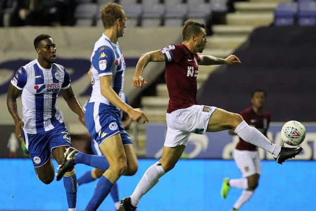 Marc Richards on the attack for the Cobblers in their defeat at Wigan Athletic