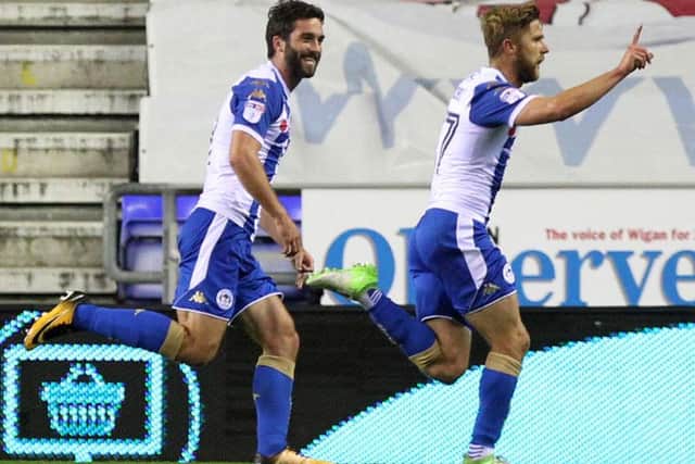 Former Cobblers player Michael Jacobs celebrates his stunning strike for Wigan Athletic at the DW Stadium (Pictures: Sharon Lucey)