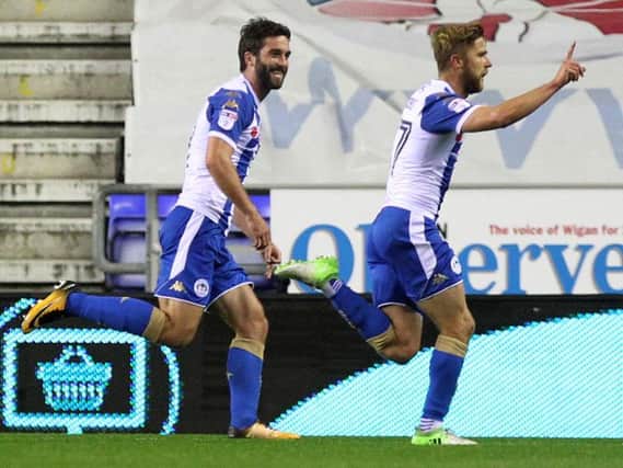 Former Cobblers player Michael Jacobs celebrates his stunning strike for Wigan Athletic at the DW Stadium (Pictures: Sharon Lucey)
