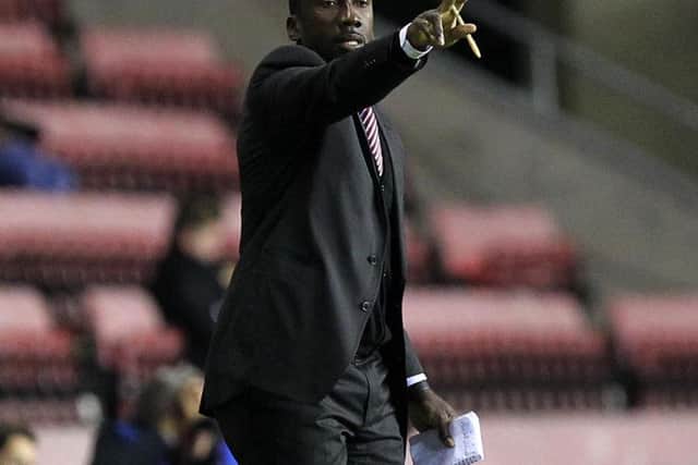 Jimmy Floyd Hasselbaink issues instructions to his Cobblers team at Wigan