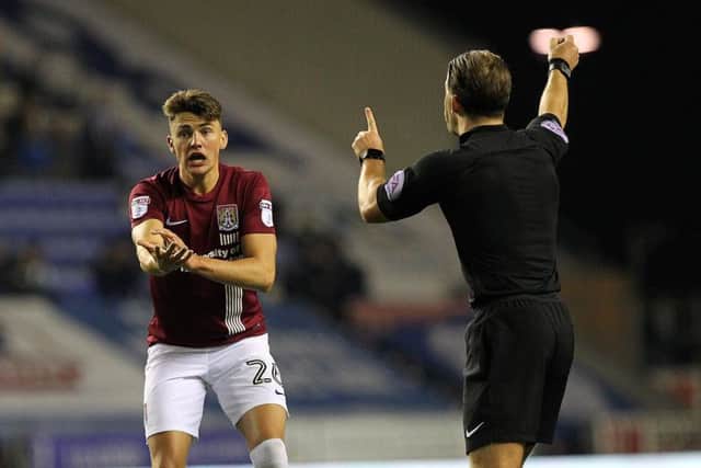 Regan Poole, like many of his team-mates, felt Cobblers were denied a stonewal penalty late on. Pictures: Sharon Lucey