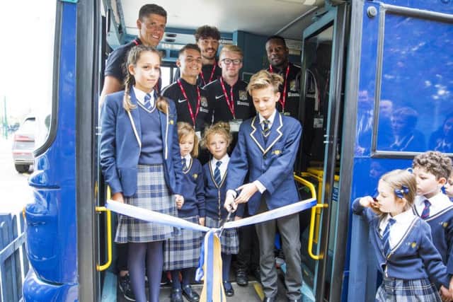 Wootton Park School children officially opened their new library yesterday with special guests from Northampton Town Football Club.