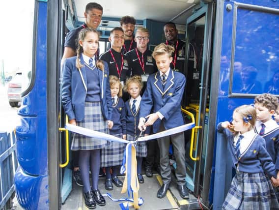 Wootton Park School children officially opened their new library yesterday with special guests from Northampton Town Football Club.
