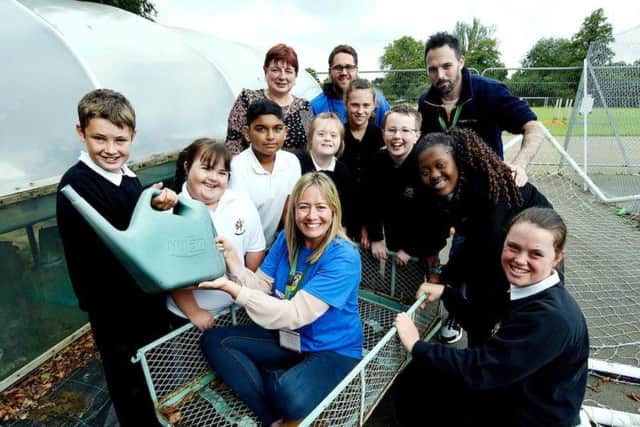 Executive assistant Rachel Norris (centre) pictured with Northgate School students and headteacher Shez Webb (back left), senior operations manager Robert Goble and HR business partner Sean Talbot