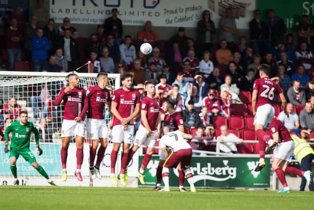 Tony McMahon curls home his free-kick for Bradford City (Pictures: Kirsty Edmonds)