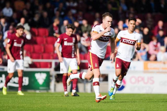 Tony McMahon celebrates his stunning free-kick against the Cobblers